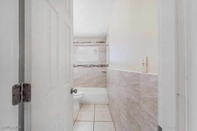 416 Rushmore Ave S, Lehigh Acres, FL 33936 - full bathroom with tile walls, tile patterned floors, and toilet