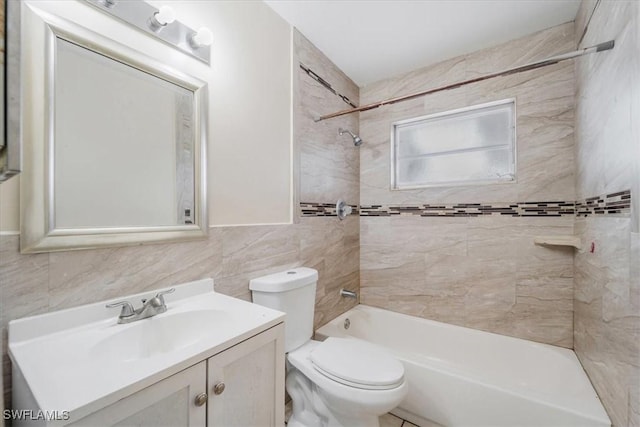 416 Rushmore Ave S, Lehigh Acres, FL 33936 - full bath featuring tile walls, vanity, toilet, and tub / shower combination