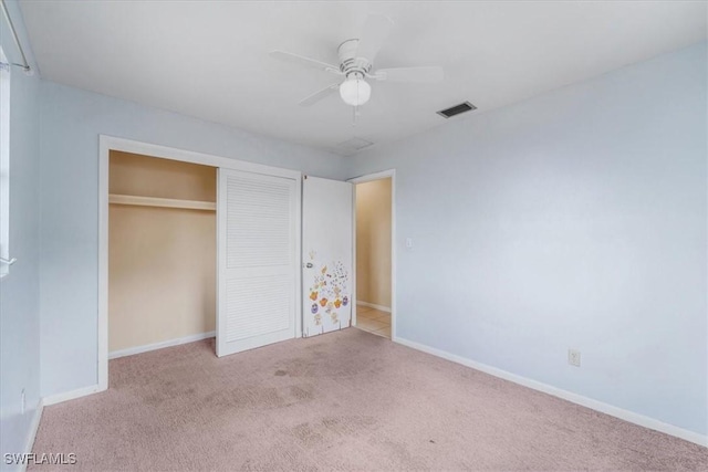 416 Rushmore Ave S, Lehigh Acres, FL 33936 - unfurnished bedroom with carpet flooring, a closet, and baseboards