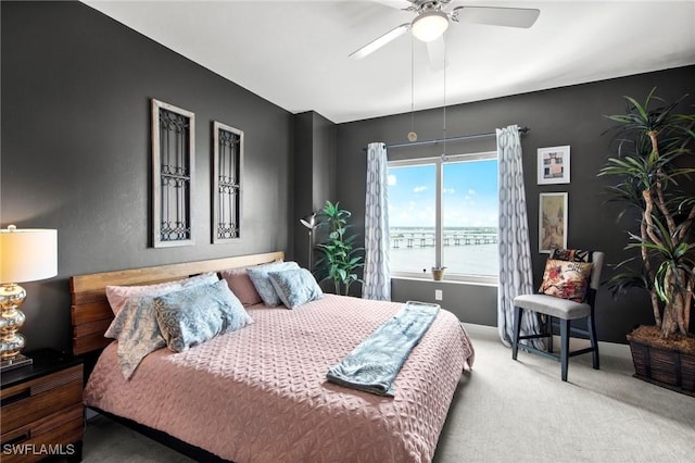 2745 1st St Unit 1602, Fort Myers, FL 33916 - carpeted bedroom with ceiling fan, baseboards, and a water view