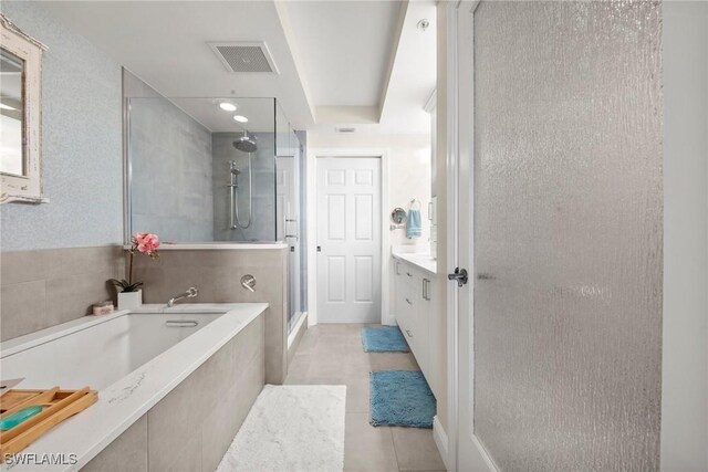 2745 1st St Unit 1602, Fort Myers, FL 33916 - full bathroom with a stall shower, tile patterned floors, a bath, and vanity
