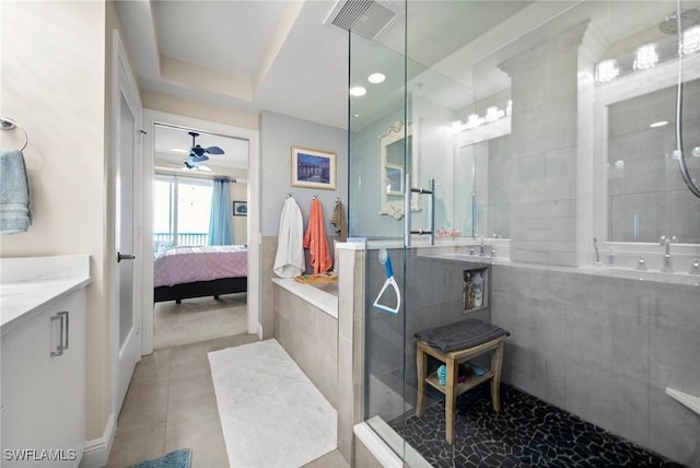 2745 1st St Unit 1602, Fort Myers, FL 33916 - full bath featuring vanity, a shower stall, ensuite bath, tile patterned flooring, and ceiling fan