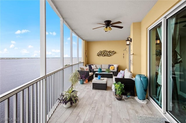 2745 1st St Unit 1602, Fort Myers, FL 33916 - sunroom / solarium with wood finished floors, a ceiling fan, outdoor lounge area, and a water view