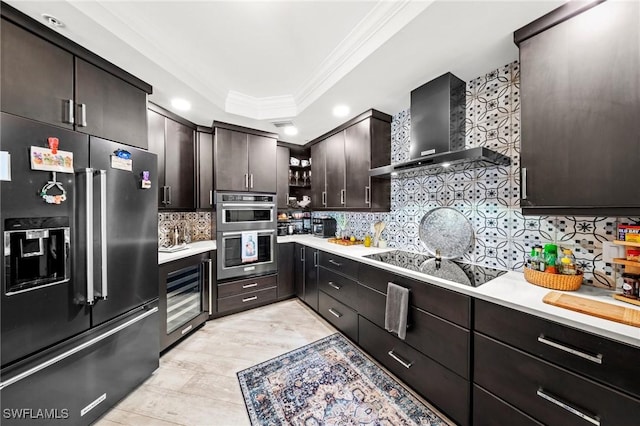 2745 1st St Unit 1602, Fort Myers, FL 33916 - kitchen with high end refrigerator, wine cooler, crown molding, wall chimney exhaust hood, and light countertops