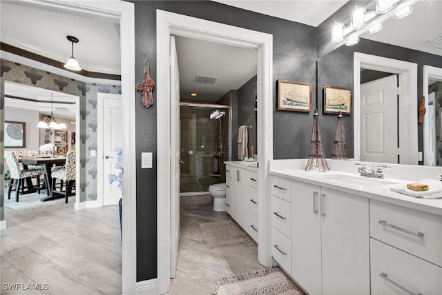 2745 1st St Unit 1602, Fort Myers, FL 33916 - full bath with vanity, a shower stall, toilet, and a chandelier