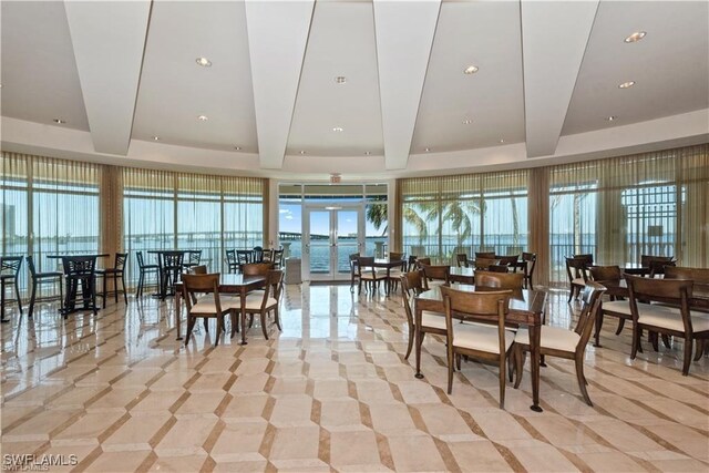 2745 1st St Unit 1602, Fort Myers, FL 33916 - dining area with beamed ceiling and a water view