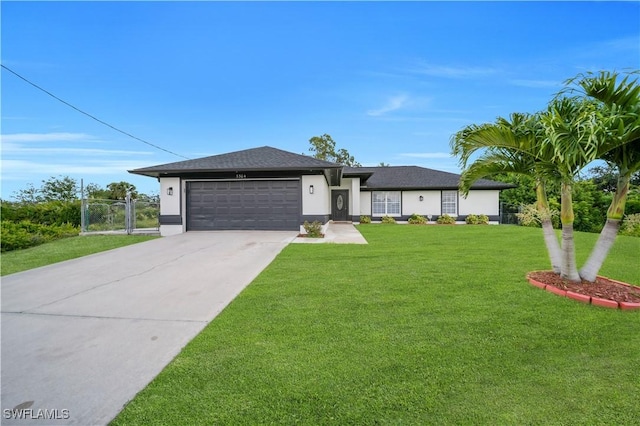 3304 44th St SW, Lehigh Acres, FL 33976 - view of front of home with a garage, driveway, a front lawn, and stucco siding