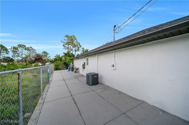 3304 44th St SW, Lehigh Acres, FL 33976 - view of home's exterior featuring stucco siding, a patio, and central air condition unit