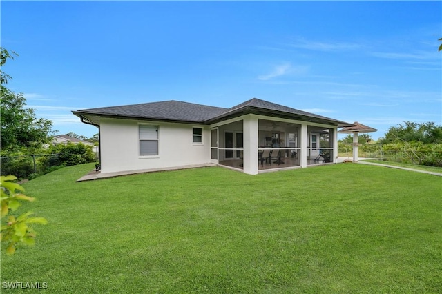 3304 44th St SW, Lehigh Acres, FL 33976 - back of house featuring a sunroom, stucco siding, and a shingled roof
