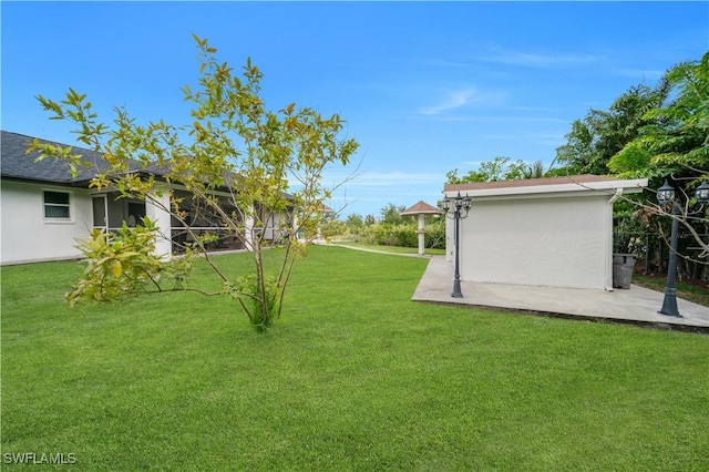3304 44th St SW, Lehigh Acres, FL 33976 - view of grassy yard featuring a patio area