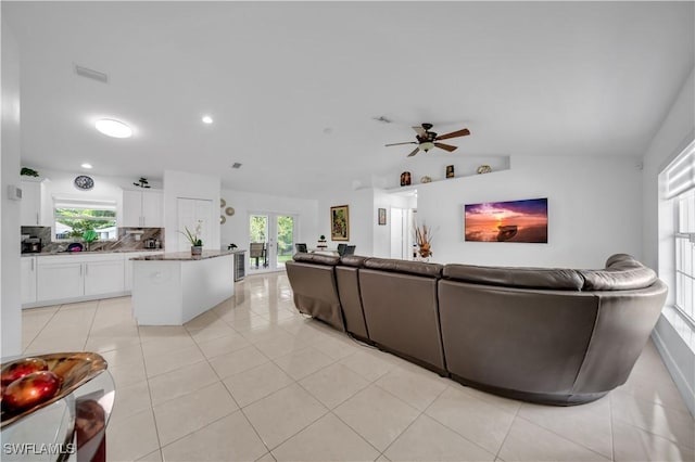 3304 44th St SW, Lehigh Acres, FL 33976 - living room featuring a ceiling fan, french doors, light tile patterned floors, lofted ceiling, and recessed lighting
