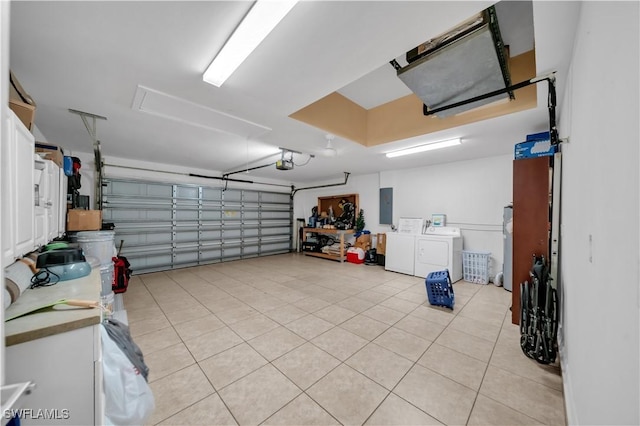 3304 44th St SW, Lehigh Acres, FL 33976 - garage with washer and dryer, electric panel, and a garage door opener