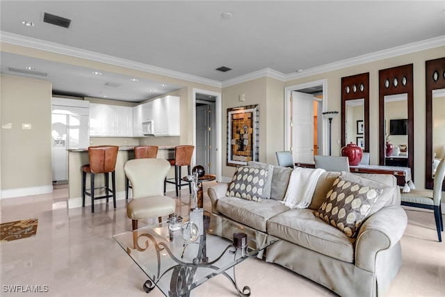 900 5th Ave S Unit 302, Naples, FL 34102 - living area featuring light tile patterned floors, crown molding, and baseboards