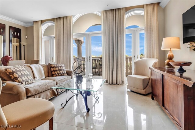 900 5th Ave S Unit 302, Naples, FL 34102 - living room featuring french doors, light tile patterned floors, and crown molding