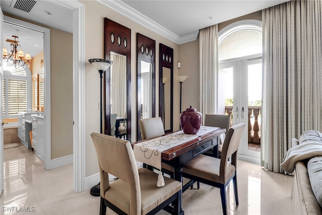 900 5th Ave S Unit 302, Naples, FL 34102 - dining space featuring french doors, a chandelier, ornamental molding, light tile patterned floors, and baseboards