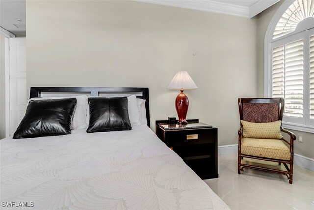 900 5th Ave S Unit 302, Naples, FL 34102 - tiled bedroom featuring ornamental molding and baseboards