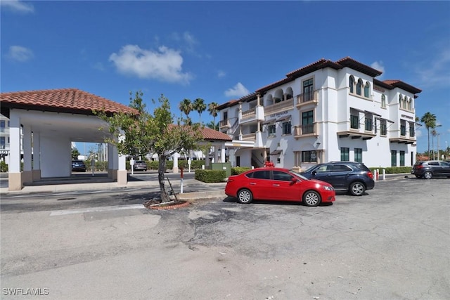900 5th Ave S Unit 302, Naples, FL 34102 - view of property featuring uncovered parking
