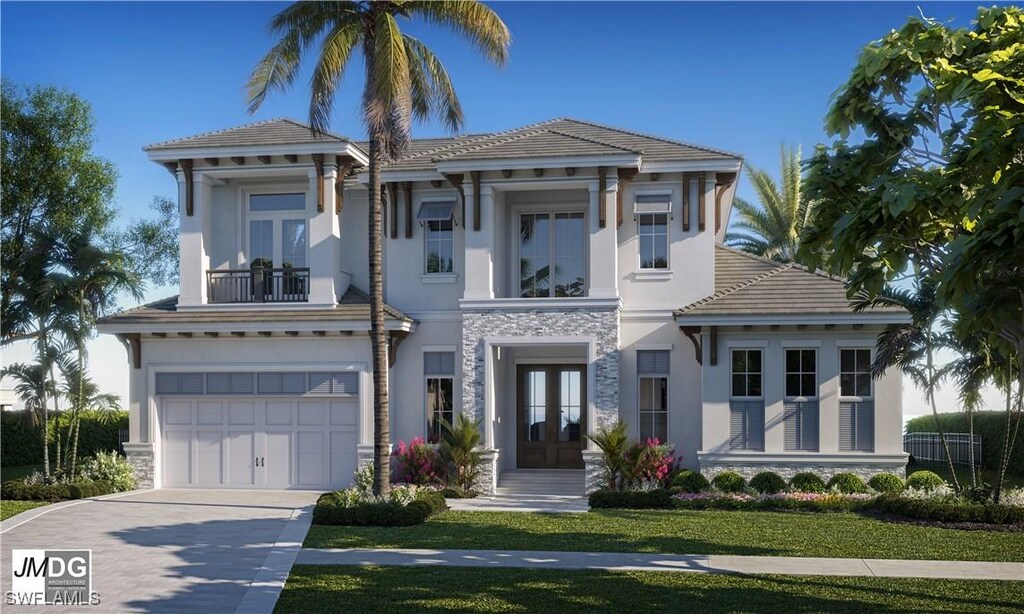 860 Banyan Ct, Marco Island, FL 34145 - view of front facade with french doors, driveway, a balcony, a garage, and stucco siding