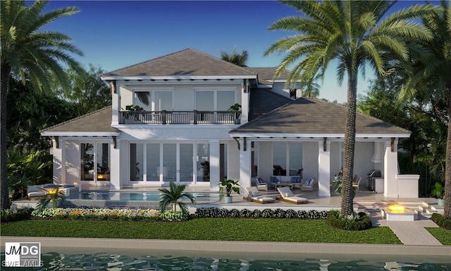 860 Banyan Ct, Marco Island, FL 34145 - back of property with a balcony, an outdoor living space with a fire pit, a patio area, and stucco siding