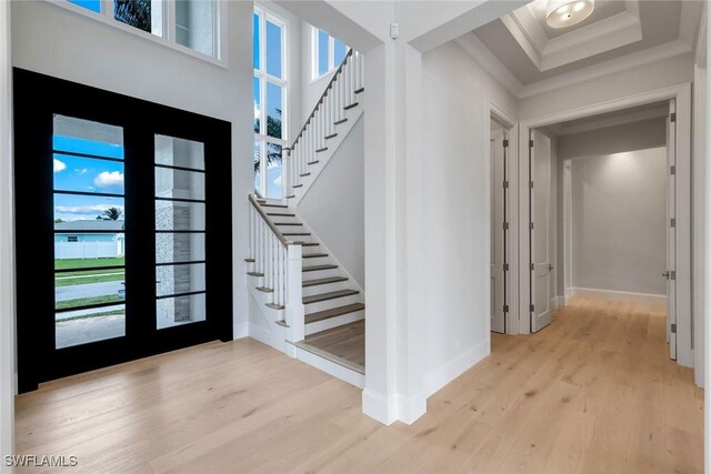 954 Sundrop Ct, Marco Island, FL 34145 - foyer entrance featuring ornamental molding, stairs, light wood-type flooring, baseboards, and french doors
