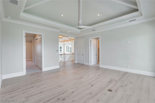 954 Sundrop Ct, Marco Island, FL 34145 - unfurnished living room with a tray ceiling, light wood-style flooring, baseboards, and crown molding