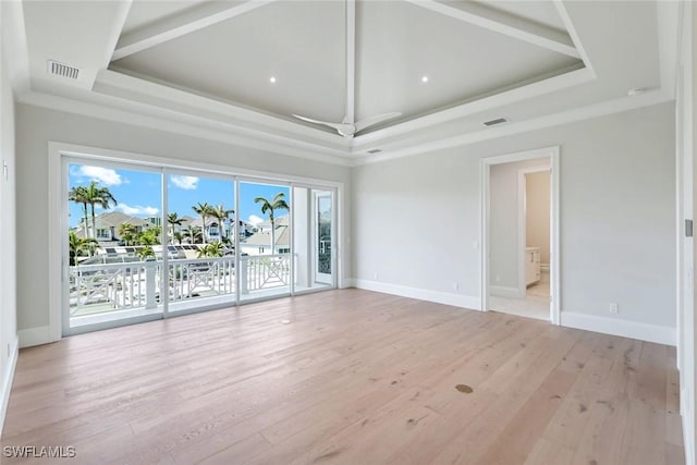 954 Sundrop Ct, Marco Island, FL 34145 - spare room featuring baseboards, light wood finished floors, and a raised ceiling