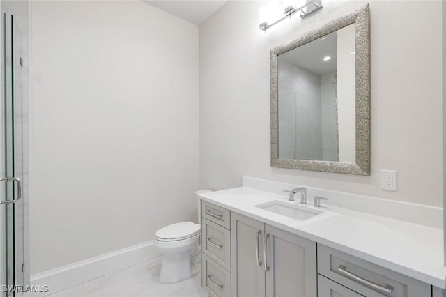 954 Sundrop Ct, Marco Island, FL 34145 - full bathroom featuring vanity, toilet, baseboards, and a shower with door