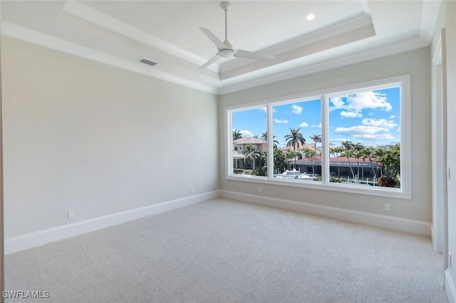954 Sundrop Ct, Marco Island, FL 34145 - spare room featuring a raised ceiling, light carpet, and baseboards