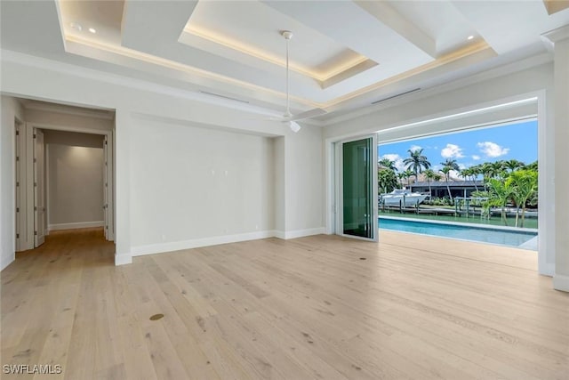 954 Sundrop Ct, Marco Island, FL 34145 - empty room with a tray ceiling, light wood finished floors, baseboards, ceiling fan, and crown molding
