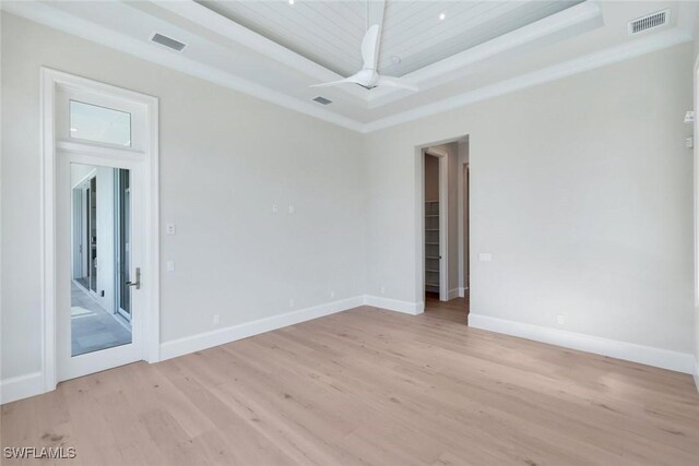 954 Sundrop Ct, Marco Island, FL 34145 - spare room featuring a tray ceiling, light wood-type flooring, ceiling fan, baseboards, and wooden ceiling