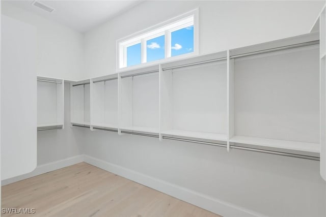 954 Sundrop Ct, Marco Island, FL 34145 - spacious closet featuring wood finished floors