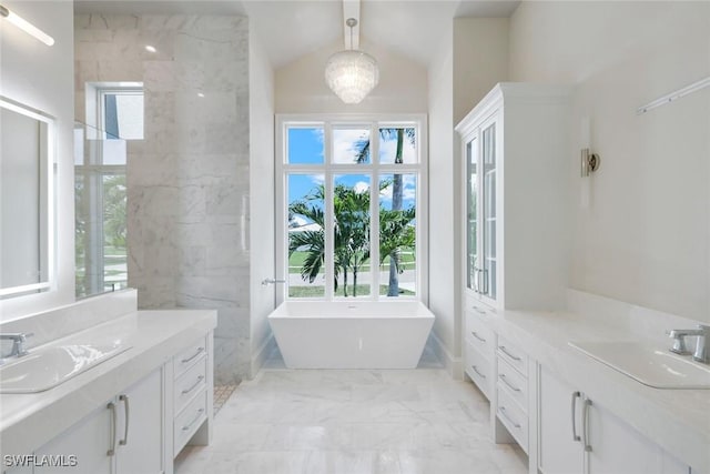 954 Sundrop Ct, Marco Island, FL 34145 - full bath featuring plenty of natural light, marble finish flooring, two vanities, and vaulted ceiling