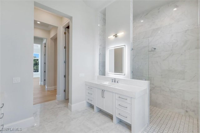 954 Sundrop Ct, Marco Island, FL 34145 - bathroom with vanity, a marble finish shower, baseboards, and marble finish flooring