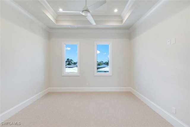 954 Sundrop Ct, Marco Island, FL 34145 - spare room with a tray ceiling, light carpet, a ceiling fan, crown molding, and baseboards
