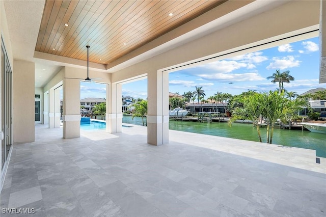 954 Sundrop Ct, Marco Island, FL 34145 - view of patio with a water view, a ceiling fan, and an outdoor pool
