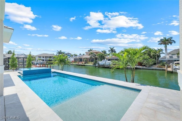 954 Sundrop Ct, Marco Island, FL 34145 - view of swimming pool with a water view, a residential view, and a pool with connected hot tub