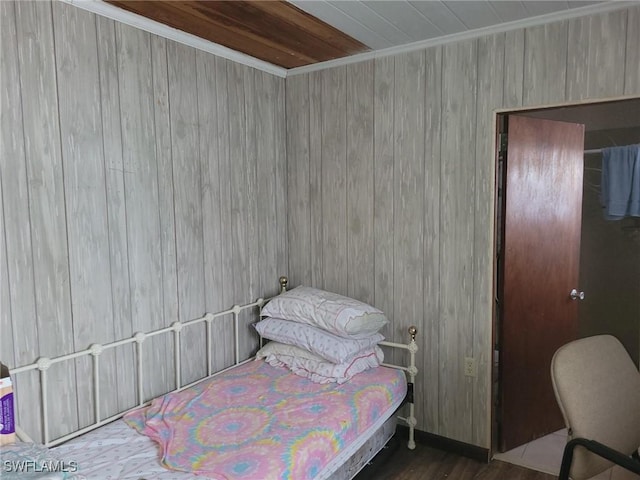 1104 Gulf St, Moore Haven, FL 33471 - bedroom featuring wood finished floors, wood walls, and ornamental molding
