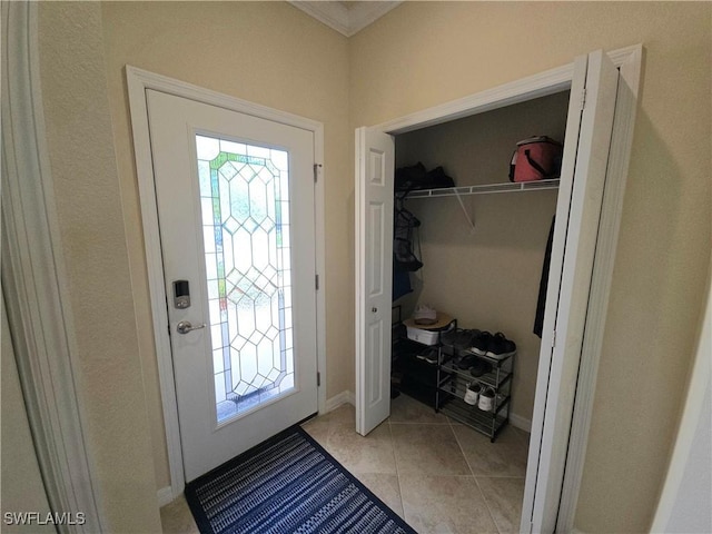 8874 Via Isola Ct, Fort Myers, FL 33966 - entryway featuring ornamental molding and light tile patterned floors