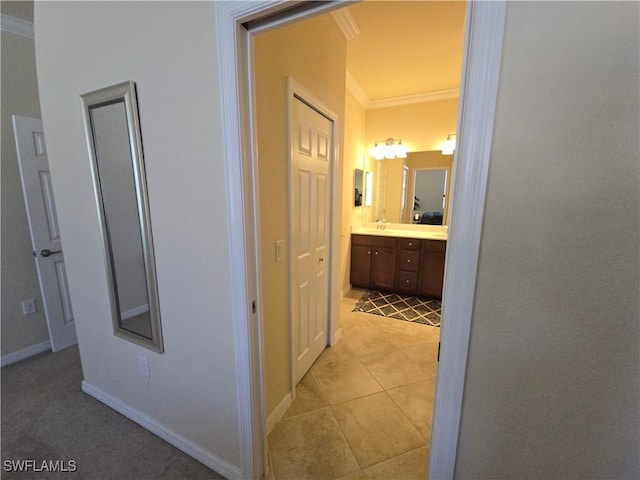 8874 Via Isola Ct, Fort Myers, FL 33966 - corridor with crown molding and light tile patterned flooring
