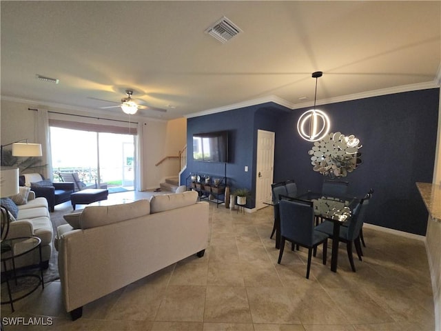 8874 Via Isola Ct, Fort Myers, FL 33966 - living area featuring stairs, a chandelier, light tile patterned flooring, crown molding, and a ceiling fan