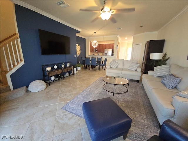 8874 Via Isola Ct, Fort Myers, FL 33966 - living area with light tile patterned floors, crown molding, ceiling fan, and stairway