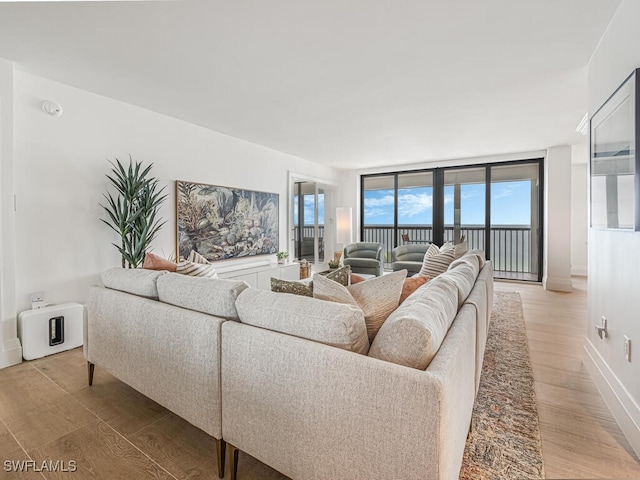 9375 Gulf Shore Dr Unit 601, Naples, FL 34108 - living area featuring light wood finished floors and baseboards