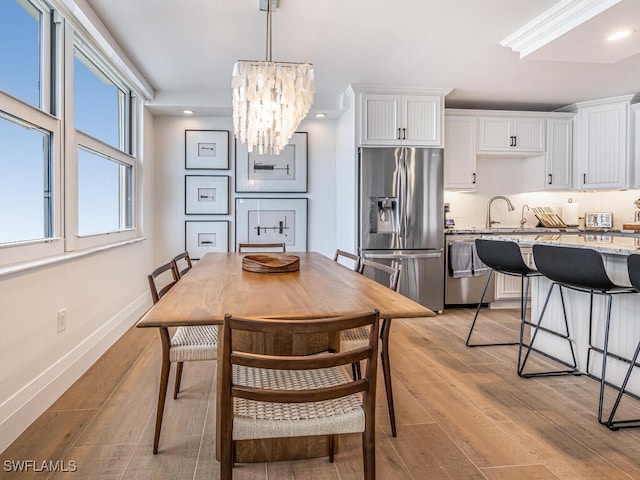 9375 Gulf Shore Dr Unit 601, Naples, FL 34108 - dining room featuring a chandelier, light wood-type flooring, recessed lighting, and baseboards