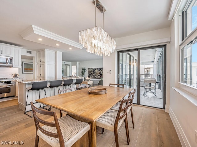 9375 Gulf Shore Dr Unit 601, Naples, FL 34108 - dining space with recessed lighting, light wood-style flooring, a chandelier, and baseboards