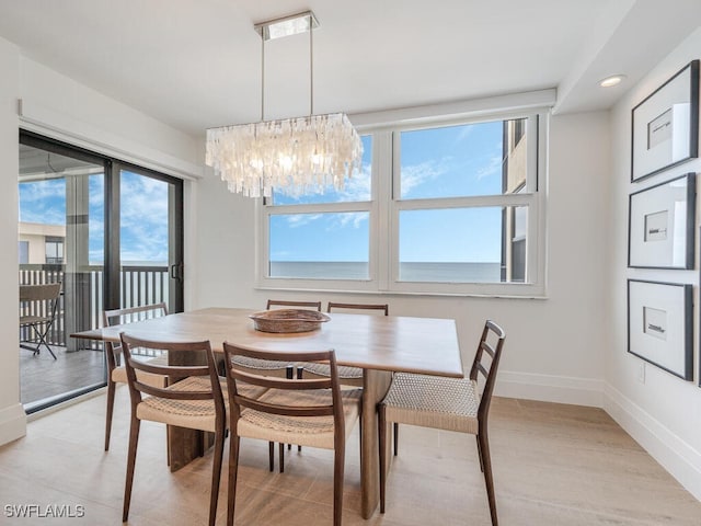 9375 Gulf Shore Dr Unit 601, Naples, FL 34108 - dining area with a chandelier, baseboards, and recessed lighting