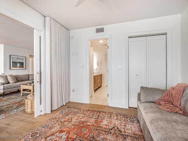 9375 Gulf Shore Dr Unit 601, Naples, FL 34108 - living area featuring ceiling fan and light wood-style flooring