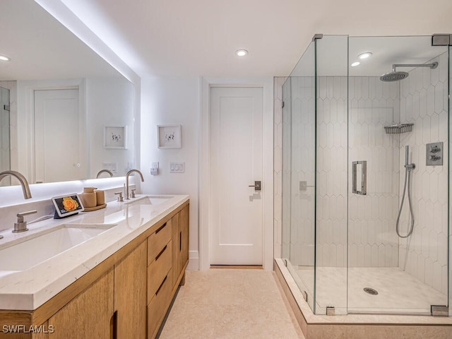 9375 Gulf Shore Dr Unit 601, Naples, FL 34108 - full bathroom featuring a stall shower, double vanity, and recessed lighting