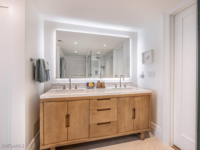 9375 Gulf Shore Dr Unit 601, Naples, FL 34108 - full bathroom with double vanity, a shower stall, recessed lighting, and baseboards