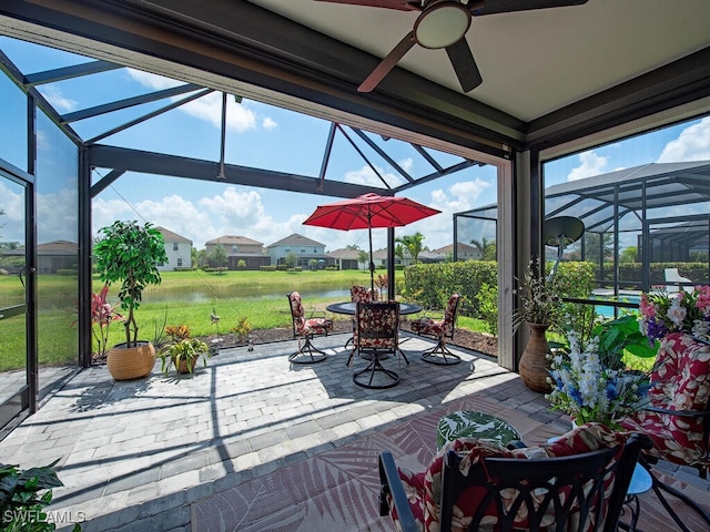2174 Clementine St, Naples, FL 34120 - view of patio featuring glass enclosure, a water view, and ceiling fan