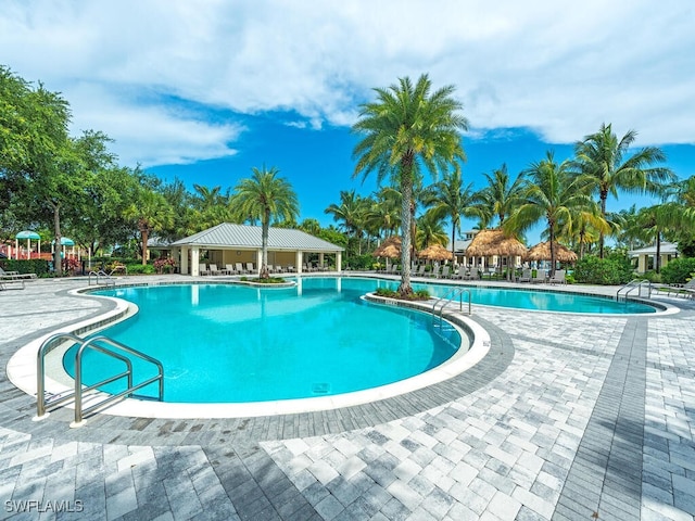 2174 Clementine St, Naples, FL 34120 - community pool featuring a patio